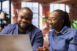 Professionals collaborating from a home office on online business work