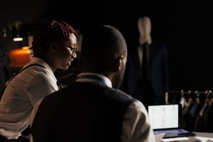 Creative professionals designing a fashion collection together
